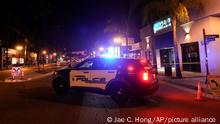 A police vehicle is seen near a scene where a shooting took place in Monterey Park, Calif., Sunday, Jan. 22, 2023. Dozens of police officers responded to reports of a shooting that occurred after a large Lunar New Year celebration had ended in a community east of Los Angeles late Saturday. (AP Photo/Jae C. Hong)