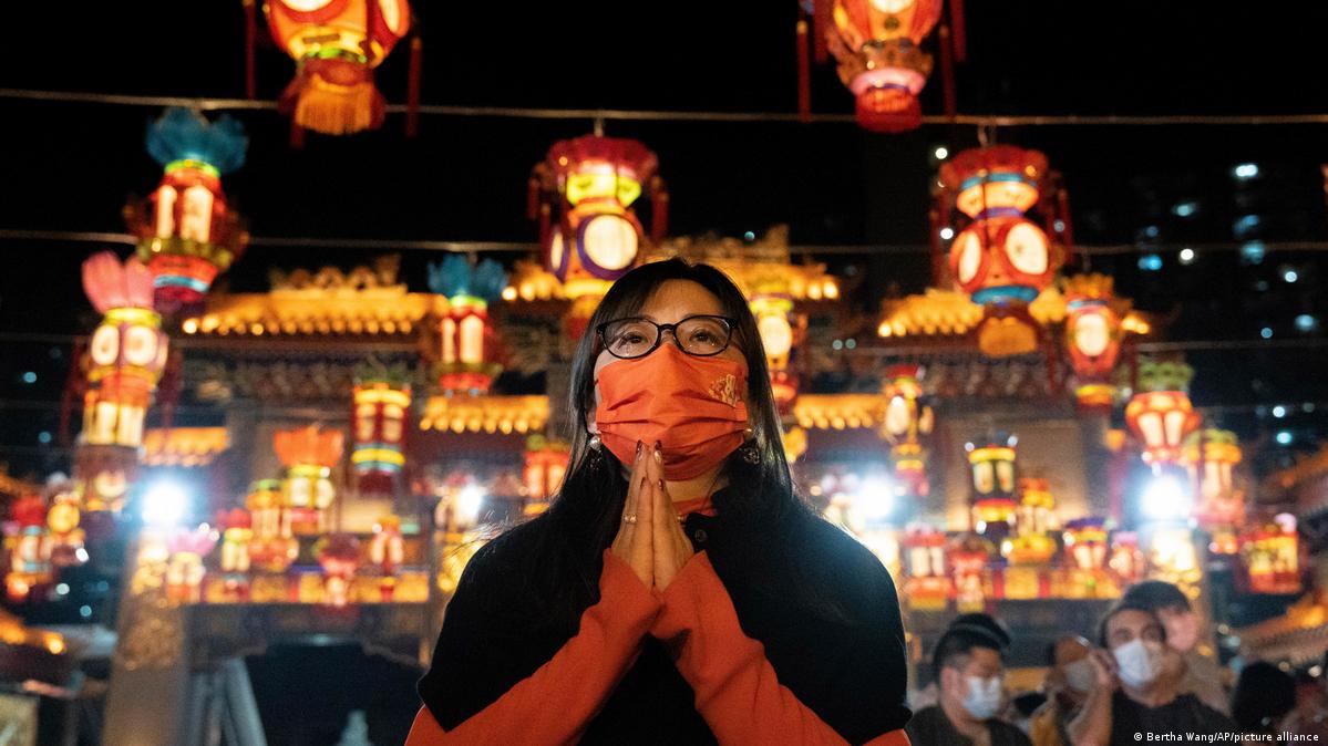 Chinese pray for health in Lunar New Year as Covid death toll rises