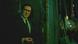Film still from 'Everything Everywhere All at Once': A man in a suit smoking in a green alley. Film still from 'Everything Everywhere All at Once': A man in a suit smoking in a green alley.