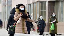 17.01.2023+++ People wearing face masks walk in Pyongyang on Jan. 17, 2023. (Kyodo)