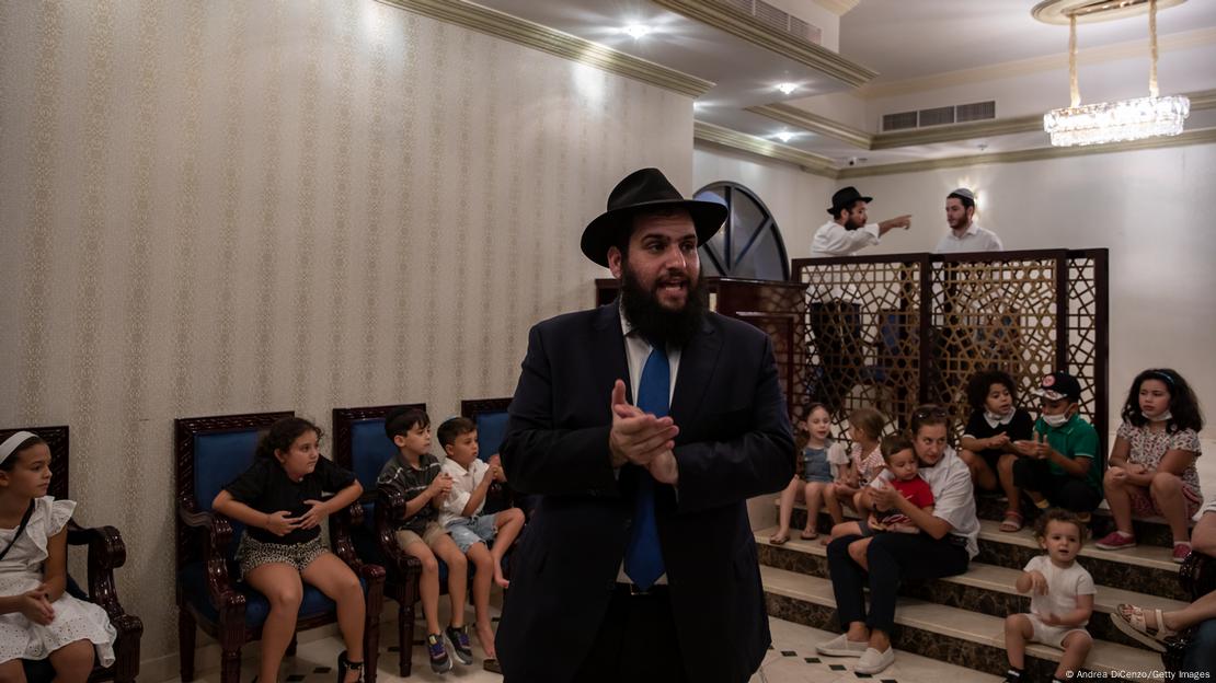 Rabbi Levi Duchman, a Brooklyn-born Chabad Rabbi who serves as the head of the Jewish Community Center of UAE, leading chants amid a group of children