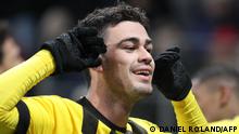 Dortmund's US midfielder Giovanni Reyna celebrates his 1-2 during the German first division Bundesliga football match between Mainz 05 and Borussia Dortmund in Mainz on January 25, 2023. (Photo by Daniel ROLAND / AFP) / DFL REGULATIONS PROHIBIT ANY USE OF PHOTOGRAPHS AS IMAGE SEQUENCES AND/OR QUASI-VIDEO