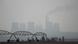 A power station in the distance amid heavy air pollution A power station in the distance amid heavy air pollution