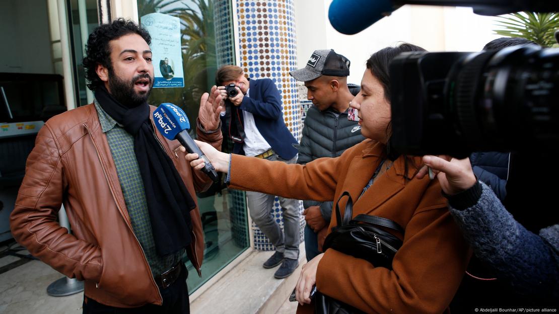 Journalist and activist Omar Radi speaks to the media after his hearing at the Casablanca Courthouse