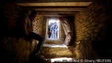 A man sits inside a tomb after the announcement of the discovery of 4,300-year-old sealed tombs, which have made a number of important archaeological discoveries dating to the fifth and sixth dynasties of the Old Kingdom, also stated that the expedition had found a group of Old Kingdom tombs, indicating that the site comprised a large cemetery, where the most important tomb belonged to Khnumdjedef, an inspector of the officials, a supervisor of the nobles, and a priest in the pyramid complex of Unas, the last kind of the fifth dynasty, in Egypt's Saqqara necropolis, in Giza, Egypt, January 26, 2023. REUTERS/Mohamed Abd El Ghany

