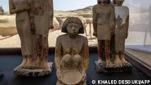 Artifacts are displayed at the Saqqara archaeological site, where a gold-laced mummy and four tombs including of an ancient king's secret keeper were recently discovered, south of Cairo on January 26, 2023. - The vast burial site at the ancient Egyptian capital Memphis, a UNESCO World Heritage site, is home to more than a dozen pyramids, animal graves and ancient Coptic Christian monasteries. Archaeologist Zahi Hawass announced the latest discovery, dating from the fifth and sixth dynasties -- around the 25th to the 22nd centuries BC -- to reporters at the dig site. (Photo by Khaled DESOUKI / AFP)
