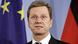 German Foreign Minister Guido Westerwelle in front of German and EU flags German Foreign Minister Guido Westerwelle in front of German and EU flags