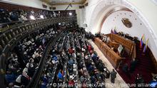 Incoming lawmakers members fill the chamber of the National Assembly during the year's first session in Caracas, Venezuela, Tuesday, Jan. 5, 2021. The ruling socialist party assumed the leadership of Venezuela's congress on Tuesday, the last institution in the country it didn't already control. (AP Photo/Matias Delacroix)
