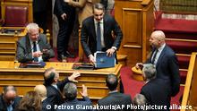 27.01.2023 Greek Prime Minister Kyriakos Mitsotakis, center, speaks with his party lawmakers during a parliamentary debate on a motion of censure in Athens, on Friday, Jan. 27, 2023. Lawmakers are to vote on the no confidence motion later Friday. With the governing center-right New Democracy party holding a comfortable majority of 156 seats in the 300-member parliament, the vote is expected to fail. (AP Photo/Petros Giannakouris)