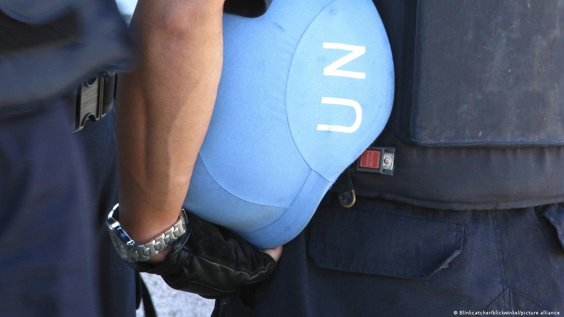 A UN soldier carrying a blue UN helmet under his arm in Port-au-Prince, undated archive image.