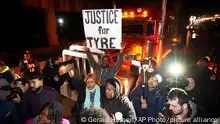 Protesters march down the street Friday, Jan. 27, 2023, in Memphis, Tenn., as authorities release police video depicting five Memphis officers beating Tyre Nichols, whose death resulted in murder charges and provoked outrage at the country's latest instance of police brutality. (AP Photo/Gerald Herbert)