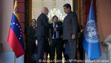 Venezuela's President Nicolas Maduro, right, shakes hands with United Nations High Commissioner for Human Rights Volker Turk, on the steps of the Miraflores presidential palace after their meeting in Caracas, Venezuela, Friday, Jan. 27, 2023. (AP Photo/Ariana Cubillos)