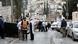 People stand near a police cordon in an area of East Jerusalem where a shooting took place on January 28 People stand near a police cordon in an area of East Jerusalem where a shooting took place on January 28