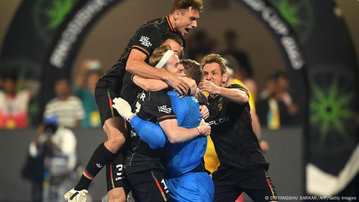 The German men form a jubilee cluster after winning the World Cup