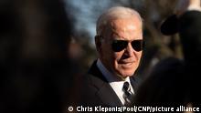 United States President Joe Biden speaks to reporters as he arrives at the White House in Washington, DC after speaking in Baltimore on January 30, 2023. Credit: Chris Kleponis / Pool via CNP