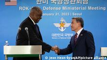 U.S. Secretary of Defense Lloyd Austin, left, shakes hands with South Korean Defense Minister Lee Jong-sup after a joint press conference after their meeting at the Defense Ministry in Seoul, South Korea, Tuesday, Jan. 31, 2023. (Jeon Heon-kyun/Pool Photo via AP)