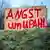 wooden sign 'Angst um Upahl' (fear for Upahl) painted onto it in red letters