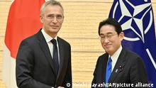 Japanese Prime Minister Fumio Kishida (R) shakes hands with Jens Stoltenberg, Secretary General of the NATOe at the prime minister's office in Tokyo on Jan. 31, 2023. ( The Yomiuri Shimbun via AP Images )