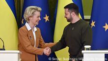 Ukrainian President Volodymyr Zelensky and President of the European Commission Ursula von der Leyen shake hands after a joint press conference after talks in Kyiv on February 2, 2023. - The European Commission chief announced she had arrived in Kyiv with a team of commissioners and the bloc's most senior diplomat, a day before a Ukraine-European Union summit in the war-torn country. (Photo by Sergei SUPINSKY / AFP) (Photo by SERGEI SUPINSKY/AFP via Getty Images)