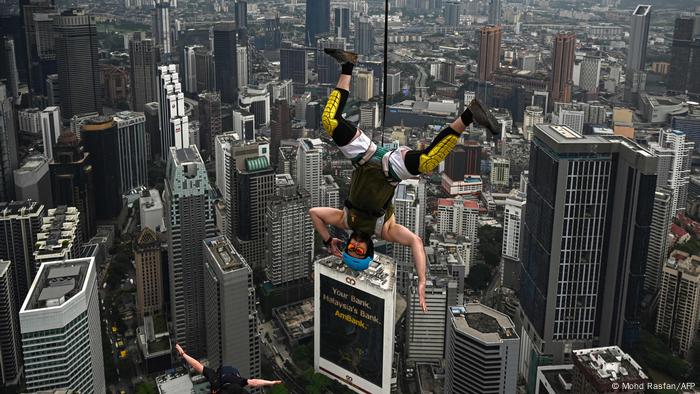Base jumper jumps from the Kuala Lumpur Tower