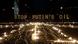 Demonstrators, and Ukrainian activists stand in front of signs reading "Stop Putin's oil" during a vigil for Ukraine near the European Union (EU) headquarters in Brussels Demonstrators, and Ukrainian activists stand in front of signs reading "Stop Putin's oil" during a vigil for Ukraine near the European Union (EU) headquarters in Brussels