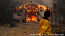 Flames consume a house during a fire in Santa Juana, Concepcion province, Chile on February 3, 2023. - Chile has declared a state of disaster in several central-southern regions after a devastating heat wave provoked forest fires that left four people dead, authorities said on Friday. (Photo by JAVIER TORRES / AFP) (Photo by JAVIER TORRES/AFP via Getty Images)