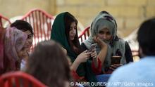 +++Islamabad, Pakistan, July 12, 2018+++
students use their mobile phones at a campus in Islamabad. - A titanic 46 million people below the age of 35 are registered to vote in nationwide elections on July 25 -- many of them savvy social media users who are utilising platforms such as YouTube and Facebook Live to undermine traditional voting patterns by posting videos calling out the powerful. (Photo by Aamir QURESHI / AFP) / To go with PAKISTAN-ELECTIONS-YOUTH-TECHNOLOGY, FOCUS by Gohar ABBAS (Photo credit should read AAMIR QURESHI/AFP via Getty Images)