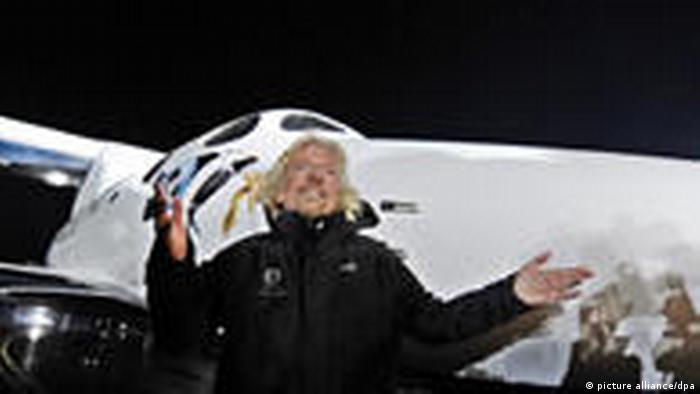 Virgin Group's Richard Branson stands in front of SpaceShipTwo during the rocket plane's worldwide debut.
