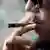 Close-up of a man smoking a joint