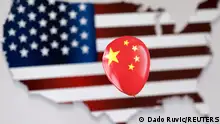 FILE PHOTO: A printed balloon with Chinese flag is placed on a U.S. flag in the shape of U.S. map outline, in this illustration taken February 5, 2023. REUTERS/Dado Ruvic/Illustration/File Photo