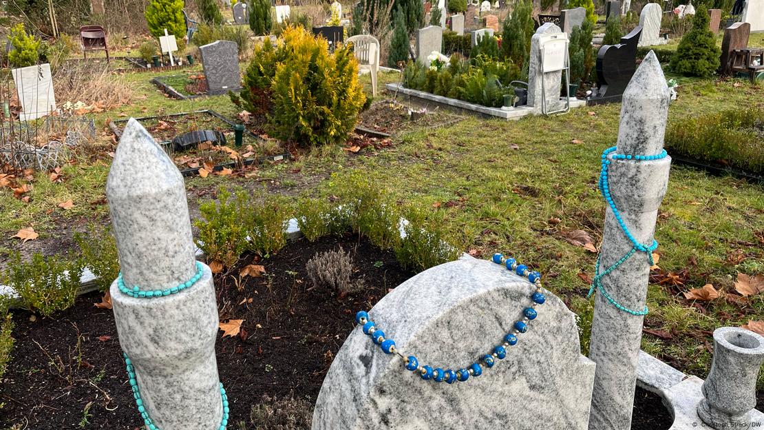 A gravestone shaped like a mosque with minarets