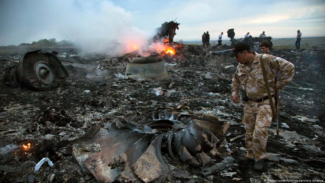 MH17 flight debris on fire in a field in Ukraine