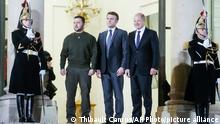 French President Emmanuel Macron, centre, and German Chancellor Olaf Scholz, right, welcome Ukraine's President Volodymyr Zelenskyy before their meeting at the Elysee Palace in Paris, France, Wednesday, Feb. 8, 2023. Western support has been key to Kyiv's surprisingly stiff defense, and the two sides are engaged in grinding battles. (AP Photo/Thibault Camus)