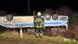 Firefighter standing in front of the overturned bus next to the highway in Magdeburg Firefighter standing in front of the overturned bus next to the highway in Magdeburg