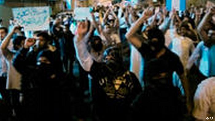 Saudi Shiite protesters chant slogans during a protest in Qatif