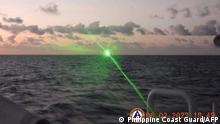 This handout photo taken on February 6, 2023 and released by the Philippine Coast Guard on February 13 shows a Chinese Coast Guard vessel shining a military grade laser light at a Philippine Coast Guard boat nearly 20 kilometres (12 miles) from Second Thomas Shoal, in the Spratly Islands in the disputed South China Sea. - The Philippine Coast Guard on February 13 accused a Chinese vessel of shining a military-grade laser light at one of its boats in the disputed South China Sea, temporarily blinding members of the crew. (Photo by Handout / Philippine Coast Guard (PCG) / AFP) / -----EDITORS NOTE --- RESTRICTED TO EDITORIAL USE - MANDATORY CREDIT AFP PHOTO / PHILIPPINE COAST GUARD - NO MARKETING - NO ADVERTISING CAMPAIGNS - DISTRIBUTED AS A SERVICE TO CLIENTS