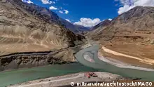 01.01.2021+++ Scenic view of Confluence of Zanskar river from left and Indus rivers from up right - Leh, Ladakh, Jammu and Kashmir, India. This is a famous tourist spot of Ladakh for all seasons.