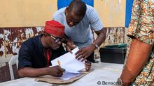 Independent National Electoral Commission (INEC) officials verify voters during a mock accreditation exercise organised by the INEC at Enitan Primary School at Surulere in Lagos, Nigeria, on February 4, 2023. - The INEC held a mock accreditation exercise of voters to test the functionality of the Bi-Modal Voter Accreditation System (BIVAS) ahead of the 2023 general election in Nigeria. (Photo by Benson Ibeabuchi / AFP)