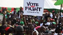 A Labour Party (LP)'s supporter holds a placard during a campaign rally at Adamasingba Stadium in Ibadan, southwestern Nigeria, on November 23, 2022, ahead of the 2023 Nigerian presidential election. (Photo by PIUS UTOMI EKPEI / AFP)
