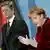 Angela Merkel gestures during her address, Guido Westerwelle stands next to her