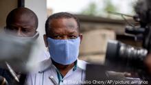 Yves Jean-Bart, president of the Haitian Football Federation, wearing a light blue protective face mask, arrives at a courthouse for a hearing regarding allegations that he abused female athletes at the country's national training center, in Croix-des-Bouquets, Haiti, Thursday, May 21, 2020. Players and former players have come forward and accused him of sexual misconduct after he threatened to remove them from the team if they did not accept his advances. Jean-Bart, who has been at the helm of the federation for 20 years, denies any wrongdoing. (AP Photo/Dieu Nalio Chery)