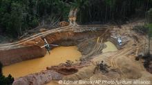 A Brazil Environmental Agency helicopter flies over an illegal mining camp during an operation to try to contain illegal mining in Yanomami Indigenous territory, Roraima state, Brazil, Saturday, Feb. 11, 2023. (AP Photo/Edmar Barros)