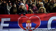 People hold a Serbian flag with the map of Kosovo during a protest against the Serbian authorities and French-German plan for the resolution of Kosovo, in Belgrade, Serbia, Wednesday, Feb. 15, 2023. Hundreds of pro-Russia nationalists have rallied outside the Serbian presidency building demanding that President Aleksandar Vucic reject a Western plan for normalization of ties with breakaway Kosovo and pull out of negotiations. Shouting “Treason” and carrying banners reading “No surrender,” the protesters on Wednesday blocked traffic in a busy street by the presidency. (AP Photo/Darko Vojinovic)