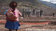 TOPSHOT - Police repel protesters from taking the airport grounds in the Andes city of Cusco, Peru, on January 19, 2023. - After weeks of unrest, thousands of protesters were expected to descend on Peru's capital Lima, defying a state of emergency to express their anger with President Dina Boluarte, who called on the demonstrators to gather peacefully and calmly. The South American country has been rocked by over five weeks of deadly protests since the ouster and arrest of her predecessor Pedro Castillo in early December. (Photo by Ivan Flores / AFP) (Photo by IVAN FLORES/AFP via Getty Images)