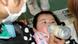 Japanese girl drinking from a baby bottle Japanese girl drinking from a baby bottle