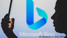June 29, 2022, Brazil. In this photo illustration, the Microsoft Bing logo is seen in the background of a silhouetted woman holding a mobile phone. June 29, 2022, Brazil. In this photo illustration, the Microsoft Bing logo is seen in the background of a silhouetted woman holding a mobile phone Copyright: xZoonar.com/rafapressx zoonar_18844367