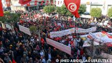 Supporters of the Tunisian General Labour Union (UGTT), carry flags and banners during a protest against what they say authority's attacks on freedoms and union rights, in Sfax, Tunisia February 18, 2023. REUTERS/Jihed Abidellaoui
