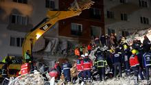 Rescuers work at the site of a collapsed building, in the aftermath of the deadly earthquake, in Antakya, Turkey February 18, 2023. REUTERS/Maxim Shemetov