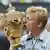Boris Becker kisses his trophy