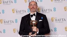 Edward Berger poses for photographers with the Director Award for the film 'All Quiet on the Western Front' at the 76th British Academy Film Awards, BAFTA's, in London, Sunday, Feb. 19, 2023 (Photo by Vianney Le Caer/Invision/AP)